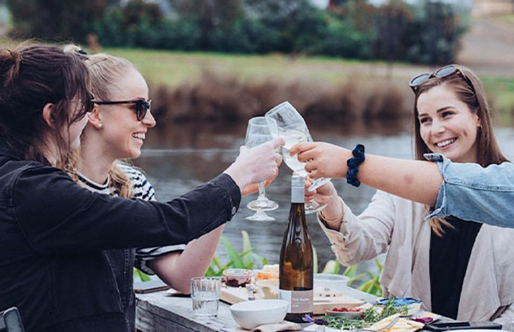 Enjoy a wine tasting by the water at Puddleduck Vineyards