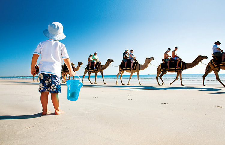 Broome kid watching camels